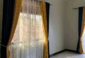 Curtains, curtain rods and cushions
