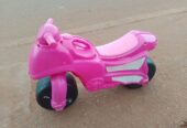 Pink toy motorcycle