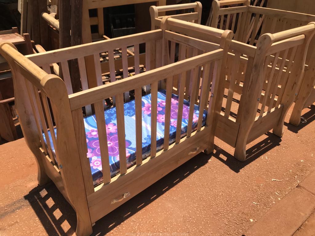 Solid baby cot bed with a drawer for baby diapers