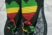 Men and women hand craft shoes