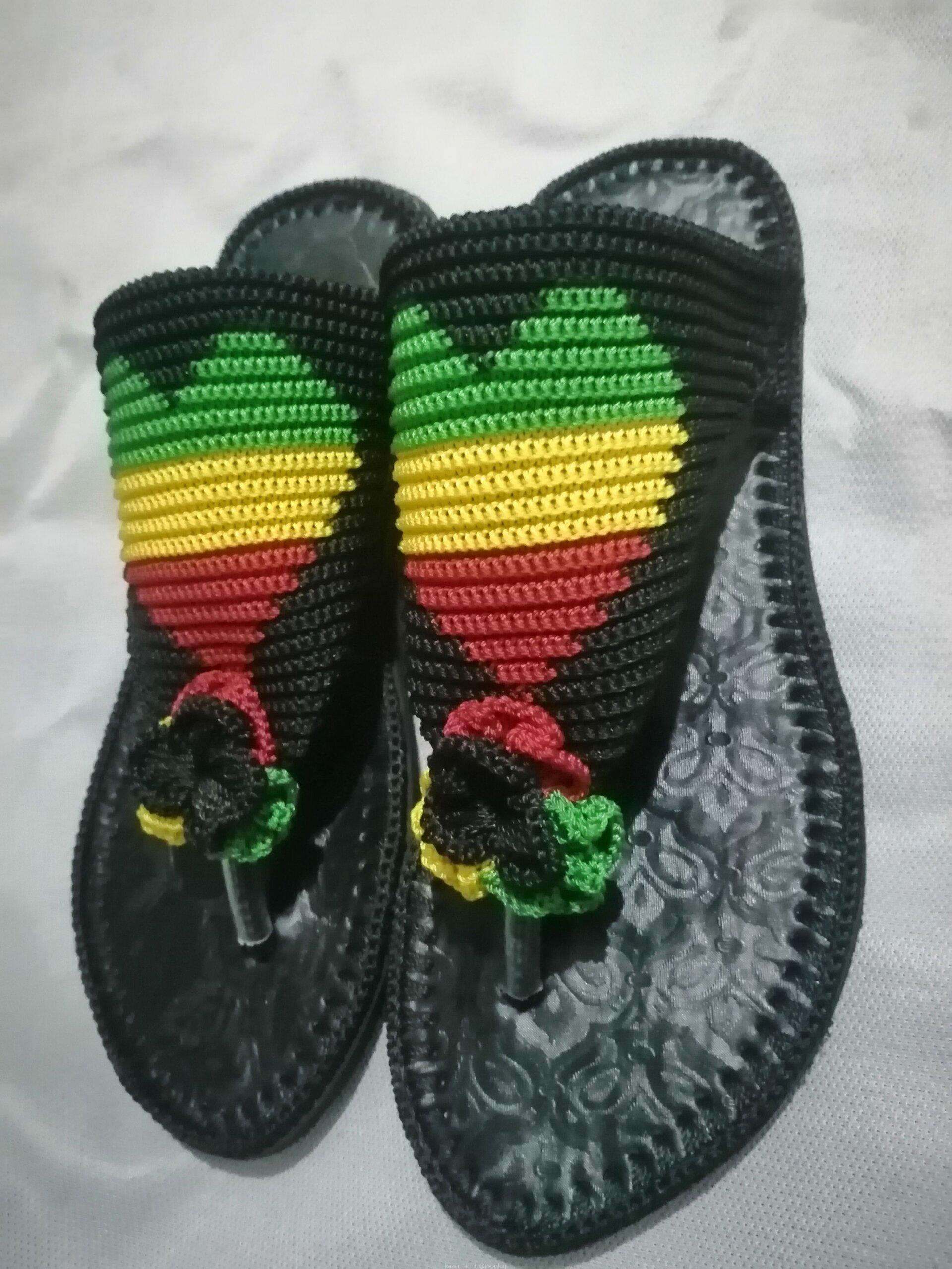 Men and women hand craft shoes