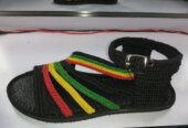 Men and women hand craft shoes