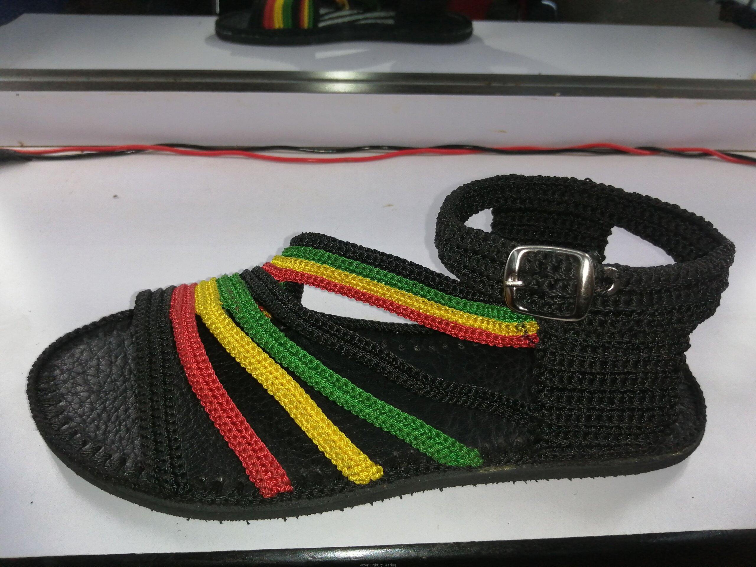 Men and women hand craft shoes