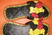 Men and women hand craft shoes