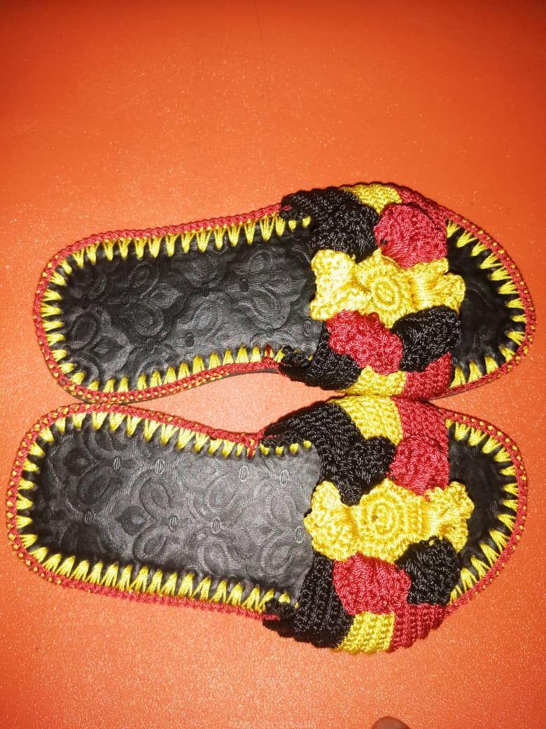 Men and women hand craft shoes