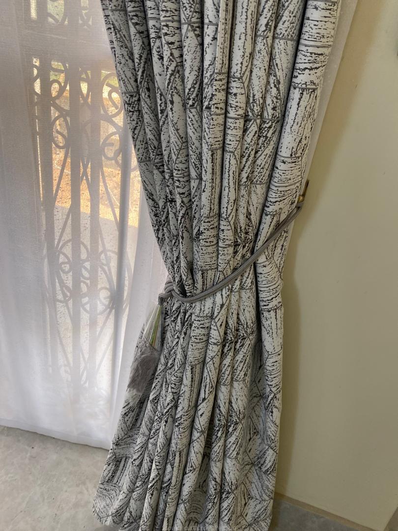 Curtains done and installed by us.