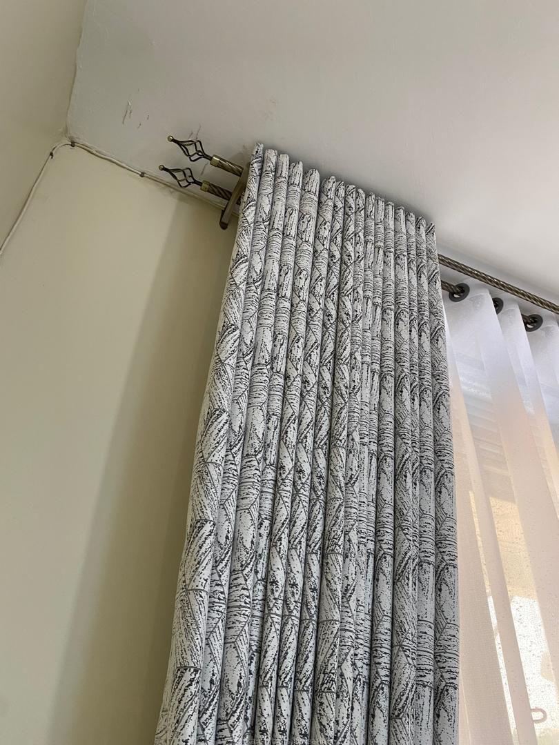 Curtains done and installed by us.