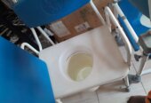 A commode pot (wheelchair)