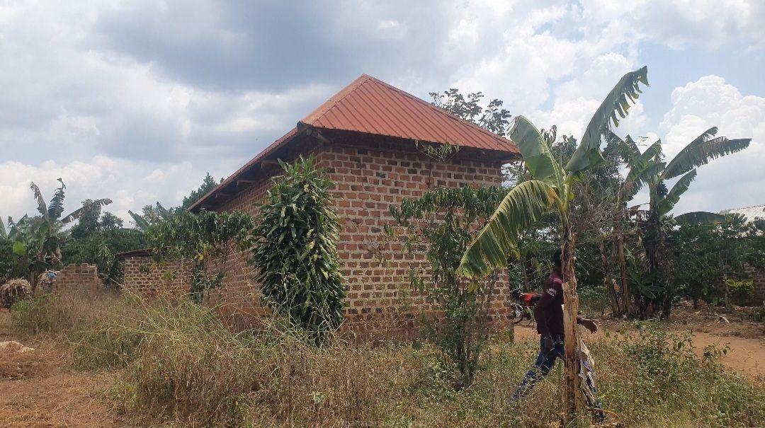 A plot (100x45ft ) plus a house for 14 million only